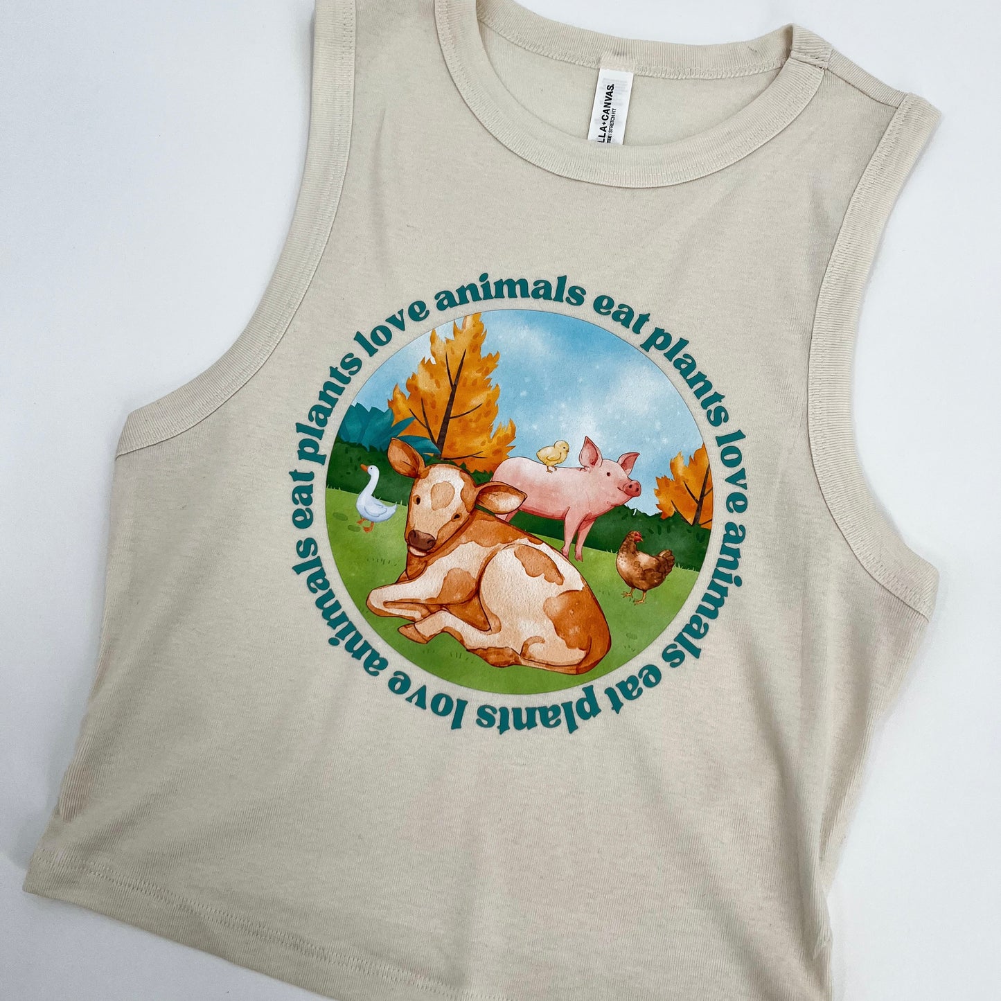 Natural colored cropped muscle tank featuring vegan activism graphic Love Animals Eat Plants