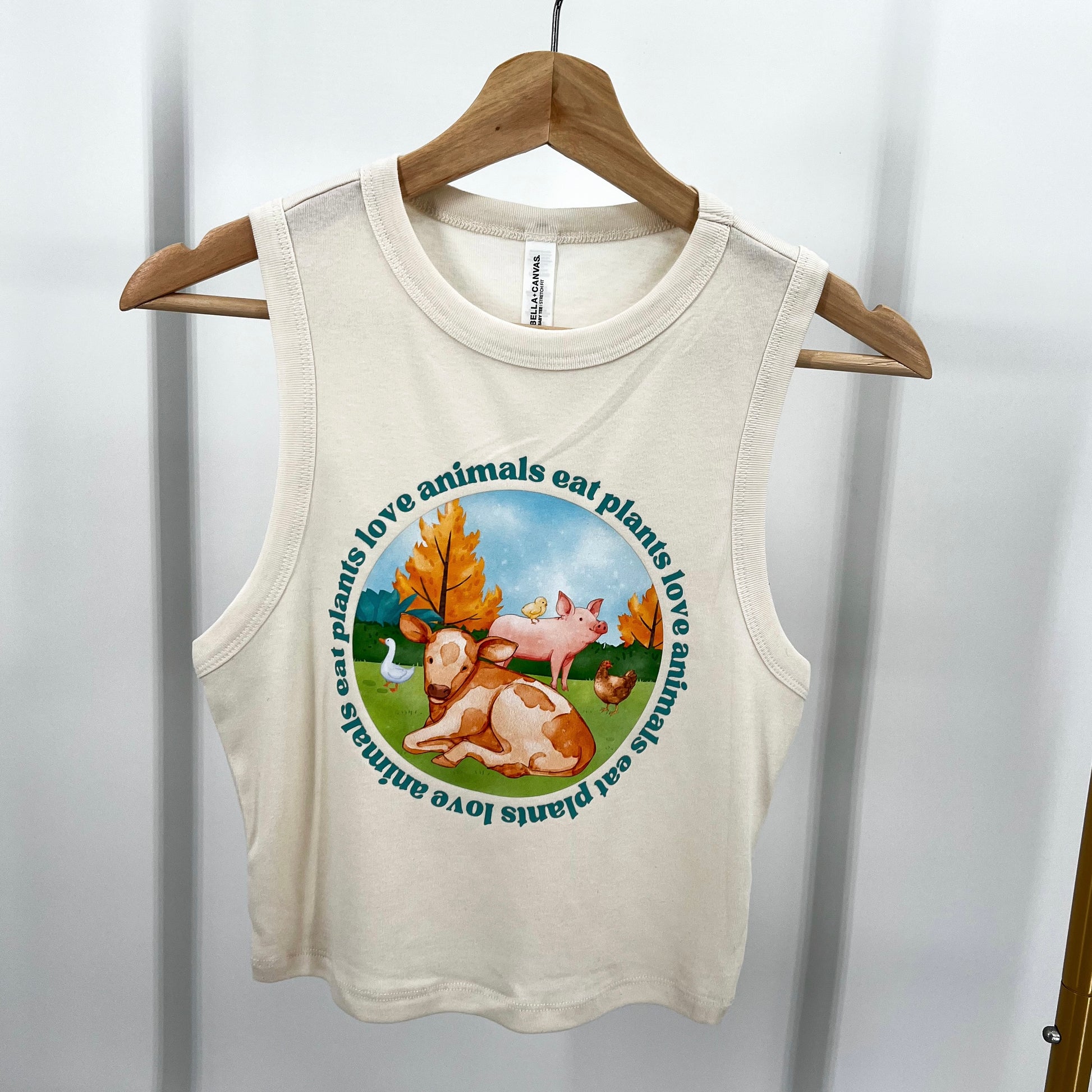 Natural colored cropped muscle tank featuring vegan activism graphic Love Animals Eat Plants