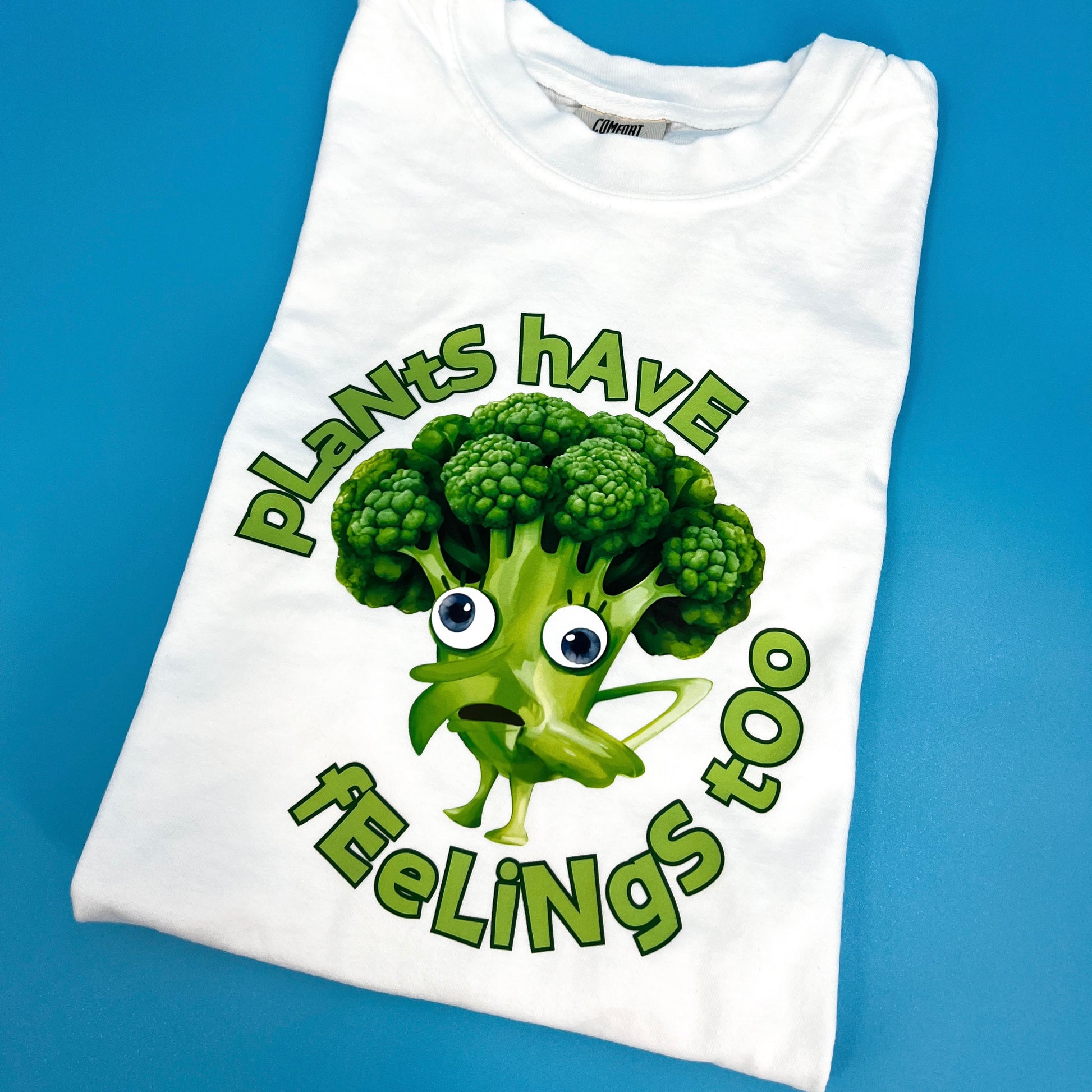 White vegan activism T-shirt featuring funny sarcastic Plants Have Feelings Too graphic