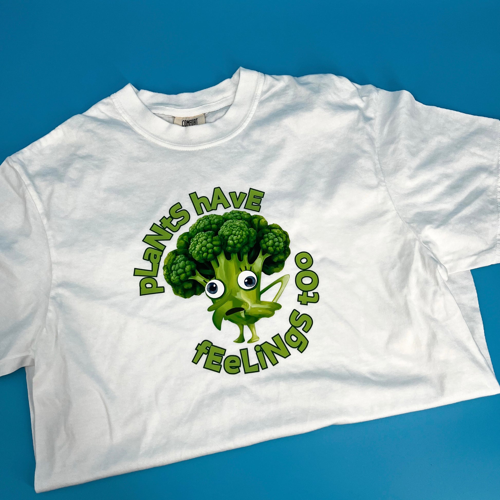 White vegan activism T-shirt featuring funny sarcastic Plants Have Feelings Too graphic