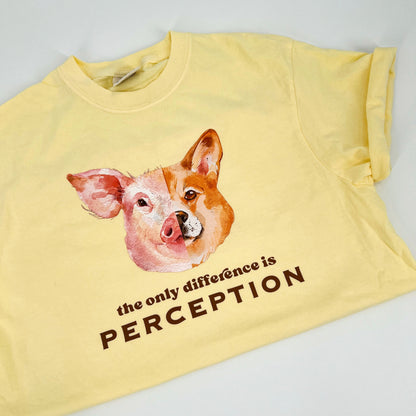 Yellow vegan activism t-shirt featuring "the only difference is perception" graphic