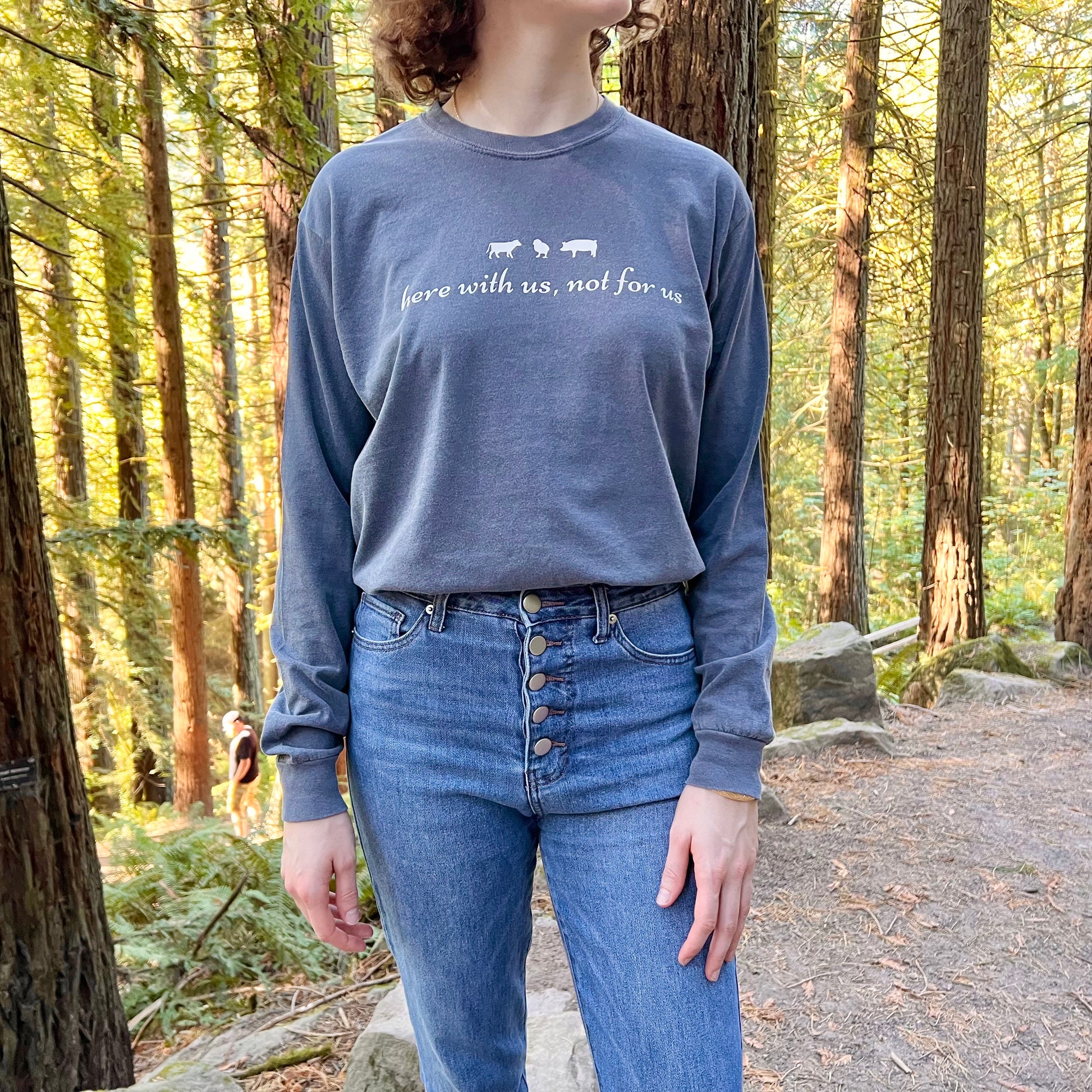 Model wearing Here With Us, Not For Us Denim Long Sleeve Vegan Activism Shirt