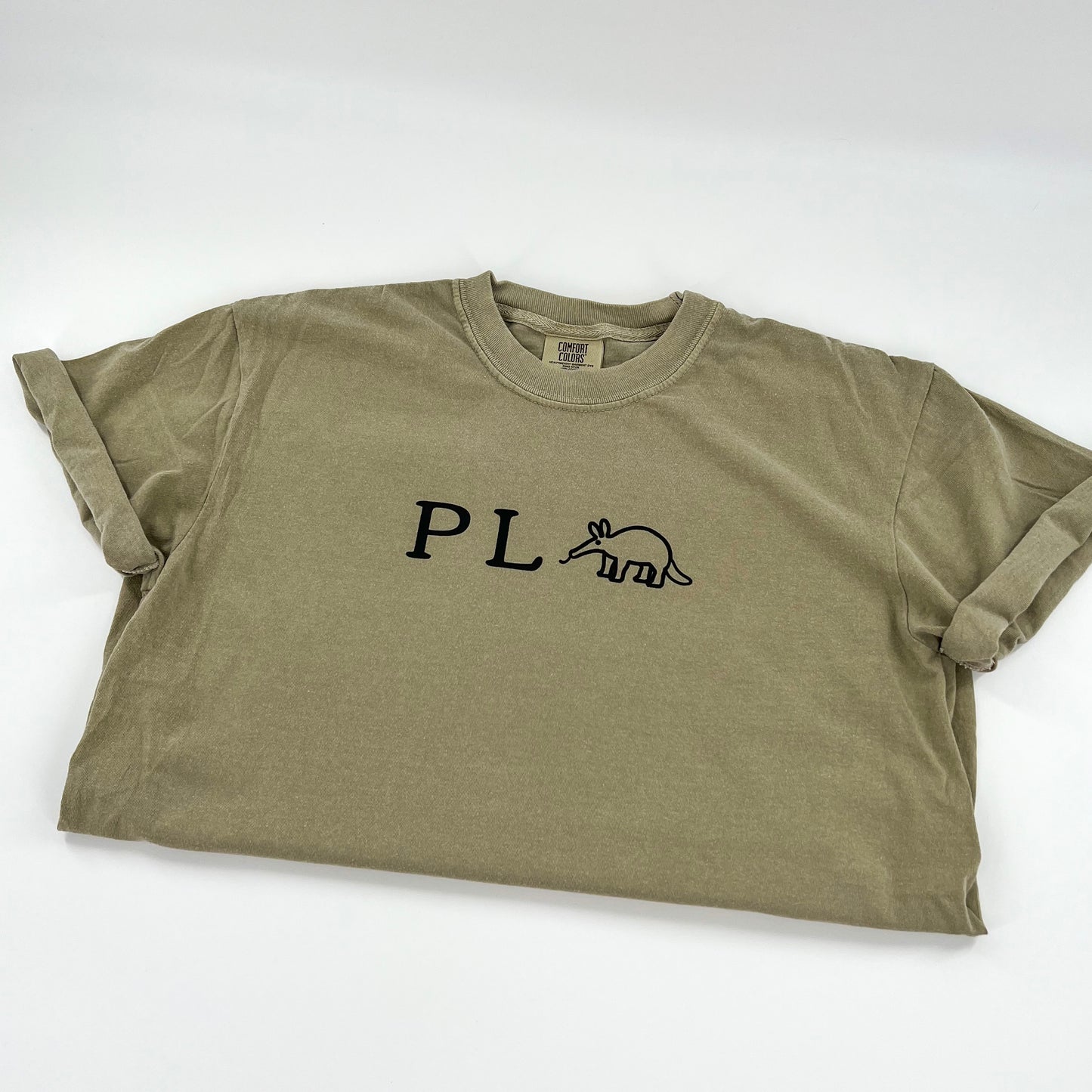 Punny P L Anteater vegan activism design in black on a khaki colored cotton shirt