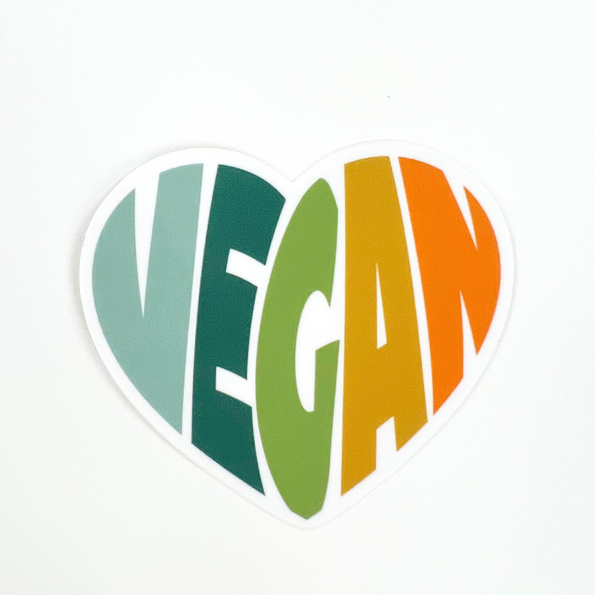 Vegan Rainbow Heart Sticker - blue, green, yellow, and orange on white background