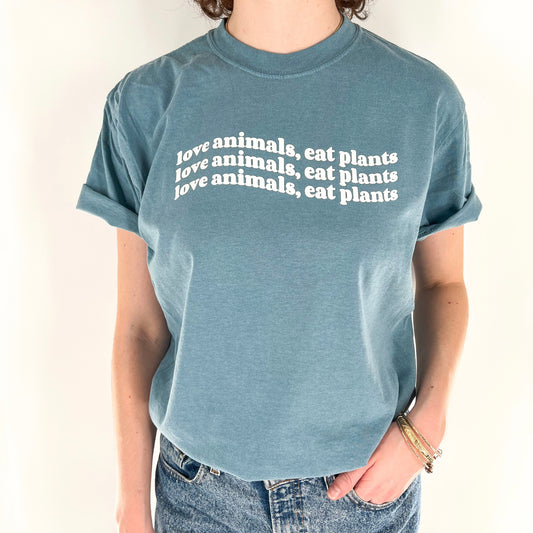 Love Animals Eat Plants vegan activism wavy design on blue short sleeve shirt
