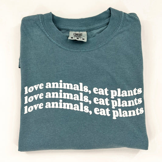 Love Animals Eat Plants vegan activism wavy design on blue short sleeve shirt  Edit alt text