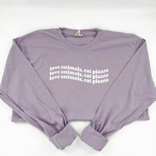 Love Animals Eat Plants purple long sleeve vegan activism shirt with wavy design